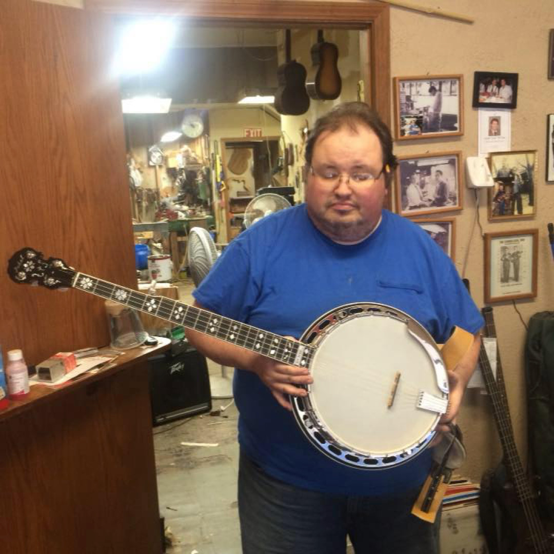 Ed holding a banjo